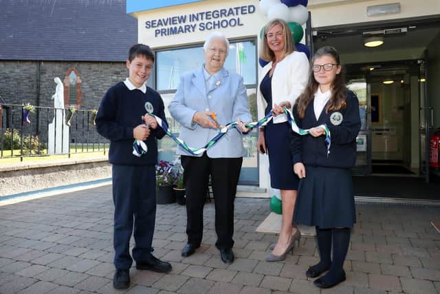 Seaview Primary School in Glenarm transferd to Controlled Integrated status in September 2021. Cutting the ribbon on day one are (left) Baroness May Blood of the Integrated Education Fund (IEF) and Joanne Mathews, Chair of the Board Of Governors. Primary 7 pupils Hayden Rhodes and Michaela McAllister help with the ceremony. Picture: PressEye





Ashley Moran teach




Miller Magill aged 4