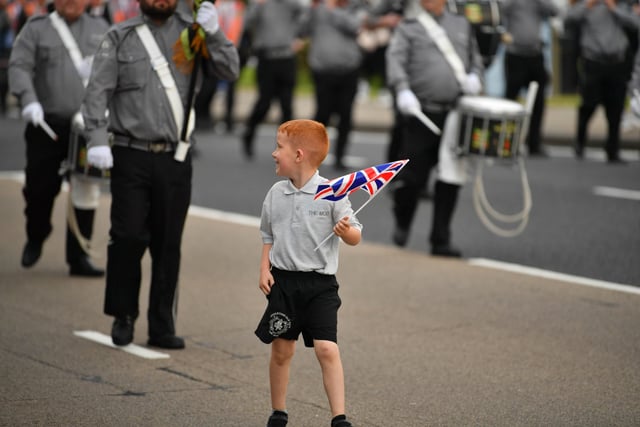 Holding tight to his flag during the parade.