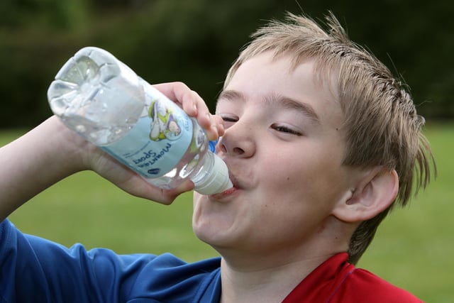 Glenn enjoys a drink of water after a race during Killowen Primary School Sports Day in June 2010