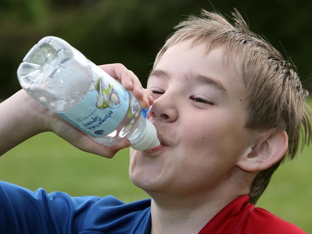 Glenn enjoys a drink of water after a race during Killowen Primary School Sports Day in June 2010
