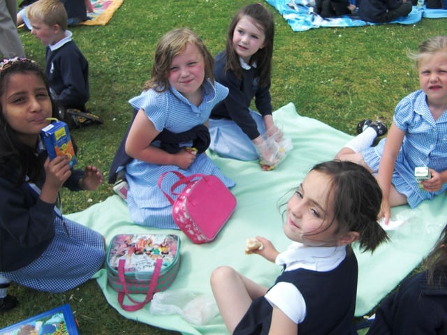 Pupils from Killowen Primary School pictured enjoying their lunches outside back in June 2010. The school canteen - Snazzy Snacks provided a take away picnic lunch for the children