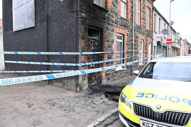 Substantial damage was caused to the front door and hallway area with further smoke damage caused throughout the house. Picture: Press Eye