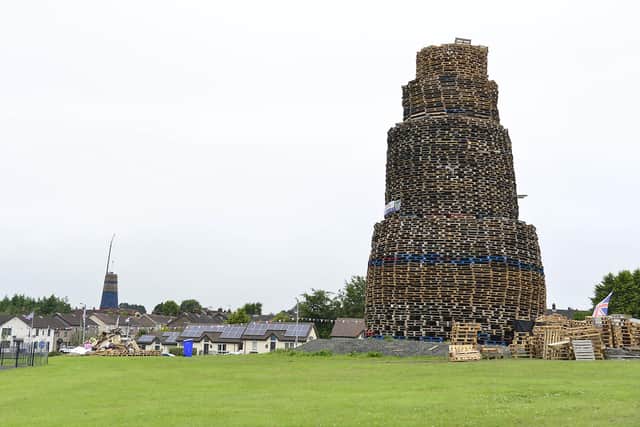 The Antiville bonfire in Larne, where a man died on Saturday night. In the background is the neighbouring Craigyhill bonfire. Picture:  Pacemaker Press