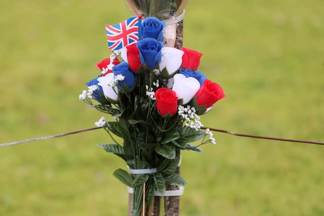 Flowers left at the Antiville bonfire scene where a local man died on Saturday night. Picture: Jonathan Porter/PressEye