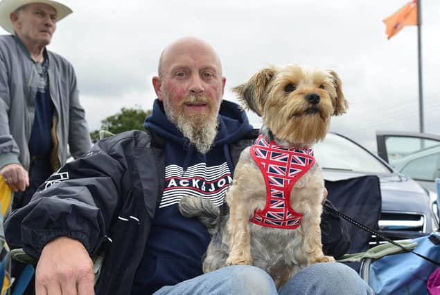 Ian Weir and his dog Lola pictured enjoying the Twelfth parade in Castlecaulfield. 
Picture : Arthur Allison/Pacemaker Press