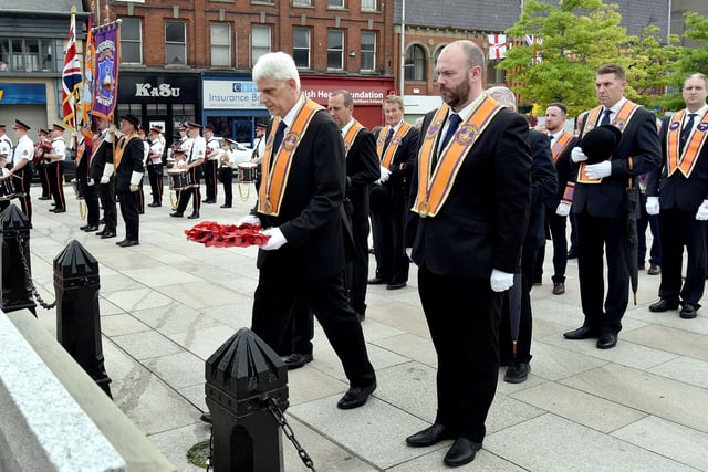 Portadown Worshipful District Master, Nigel Dawson lays a wreath at the War Memorial during the Twelfth parade. PT28-214.