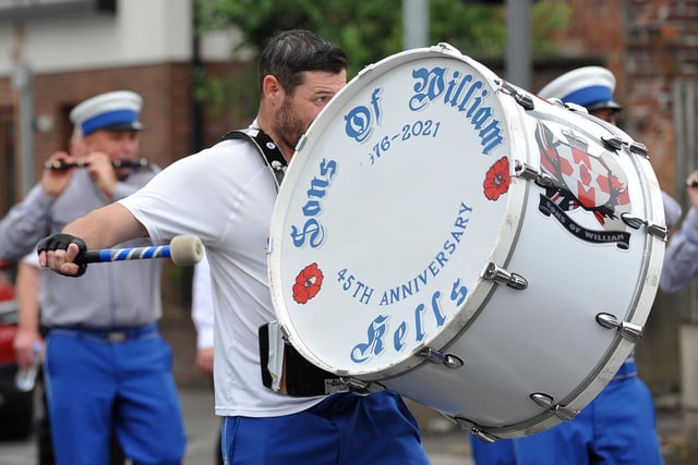 Sons of William Kells keep the beat during the parade. Picture: Pacemaker Press
