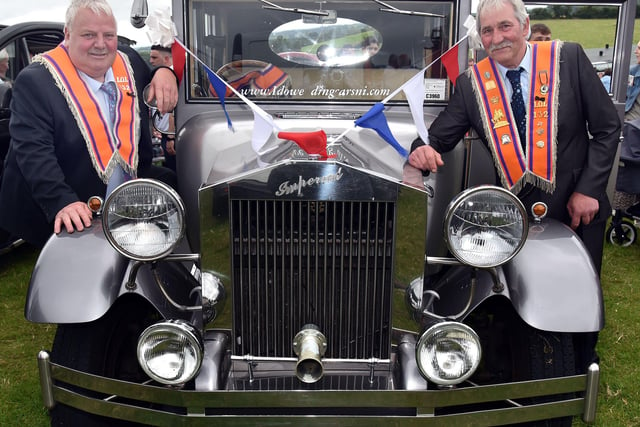 Classic Orange... Davy Coulter, left, and William McCrum from Markethill LOL 132 posing proudly with a vintage car at the field in Armagh. NL28-225.