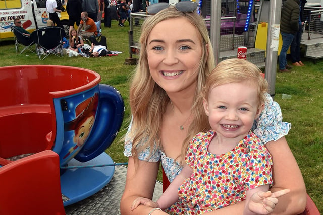 Having A Cuppa...Enjoying a go on the teacup ride at the Armagh 12th are Ashleigh Wortley and daughter, Darcie-Mae (2). NL28-220.