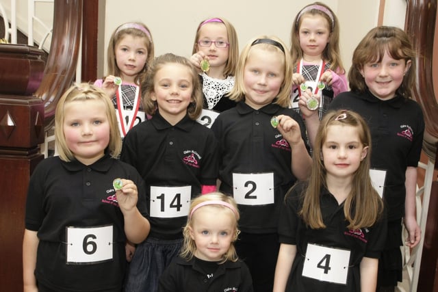 These young dancers show their medals won during the Claire McDowell School of Irish Dancing Festival in October 2009