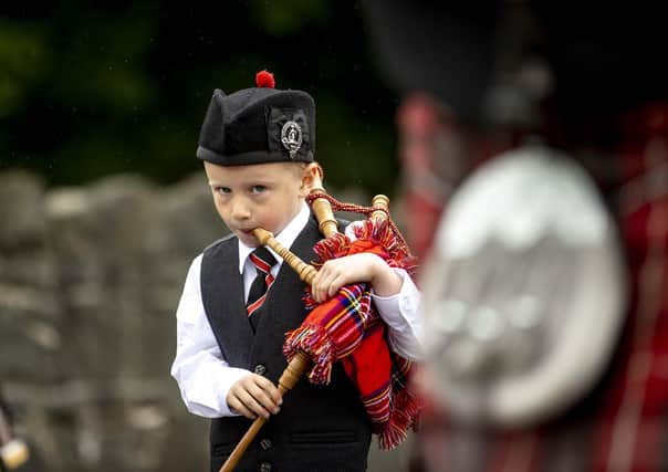 A young piper concentrates on the job in hand during the Braid District parade.