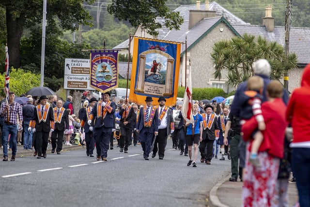The parade makes its way through Glenarm as part of the Braid District Twelfth demonstration.