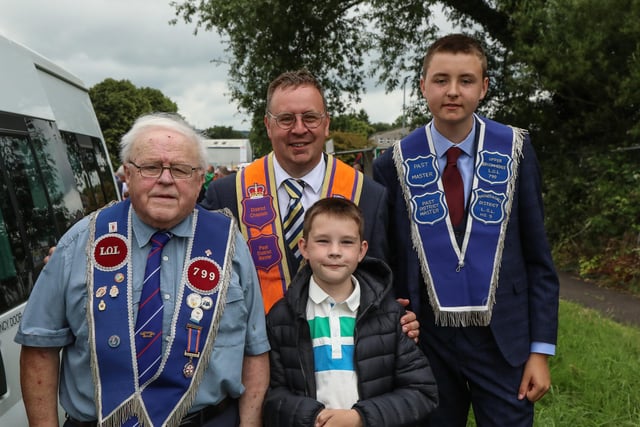 Magheragall District Chaplain Mark Jamison with his Father & Sons before the main Parade