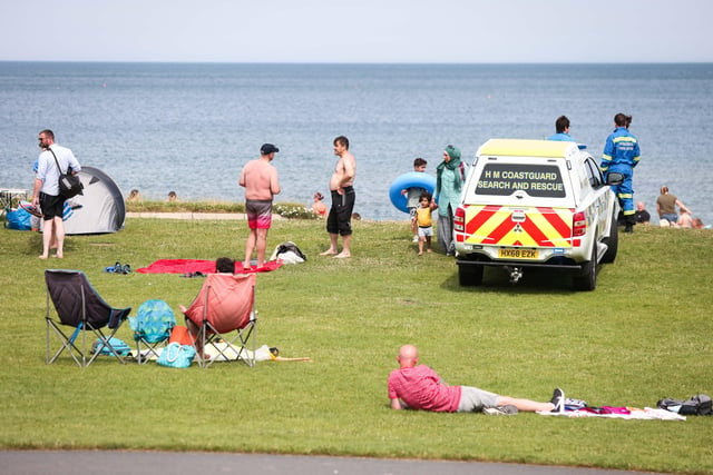 Members of HM Coastguard observe the public enjoying the weather at Crawfordsburn Country Park on Sunday afternoon. 

Picture:  Kelvin Boyes / Press Eye.