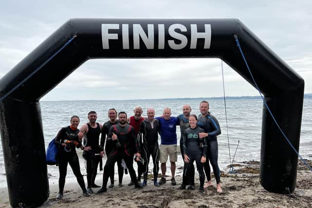 Organiser Gary Davison with swimmers at Carrickfergus.