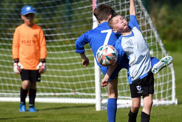 Oxford United under-9's striker Michael O'Connor tussles with Ballinamallard United's Alastair McCreesh at Oakgrove 'A' on Monday. Picture by Keith Moore