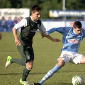 Ballymena United striker Jamie Davidson battles for possession during their Foyle Cup Under-19's final against Hibernian on Friday night. 2407JM03