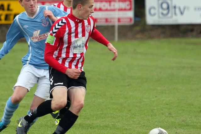The Derry City player slips past Ballymena’s Jamie Ross, during action in their Foyle cup under 19 game at McCourt’s INLS 1230-535MT.