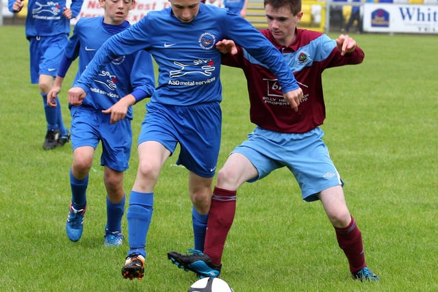 Institute’s Mathew Lynch, tussles with  Ballinamallard’s Connor Keys, in their Foyle cup under 14 game at the Riverside Stadium.  INLS 1230-526MT.