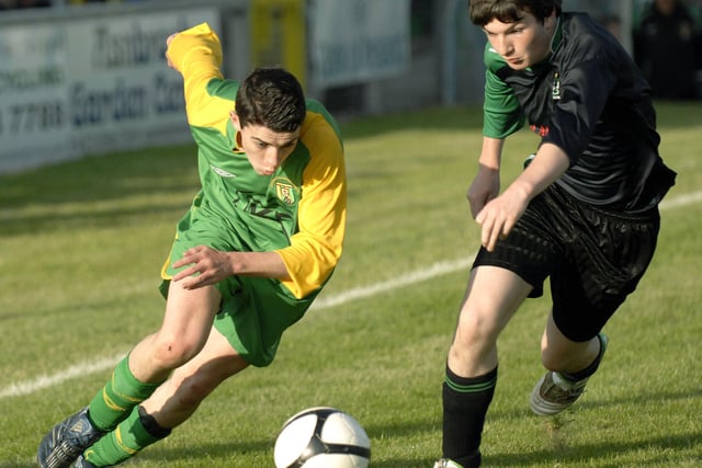 Donegal Schoolboys winger Conor Doherty races past Draperstown Celtic defender Odhran McGuigan during their Under-15's final at the Riverside Stadium. 2407JM11