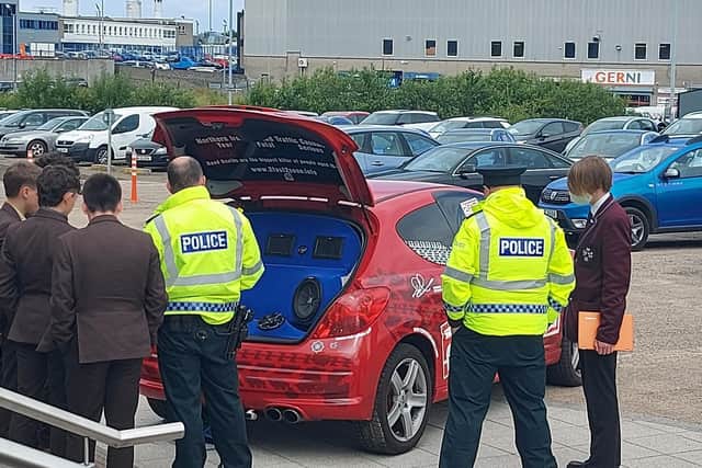 Police Officers show young people the 2 Fast 2 Soon vehicle, part of the Causeway Coast and Glens PCSP road safety initiative