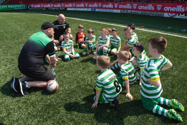 Top of the Hill Celtic players receive a team-talk ahead of Monday's O'Neill Foyle Cup U8 game. Picture by Jim McCafferty