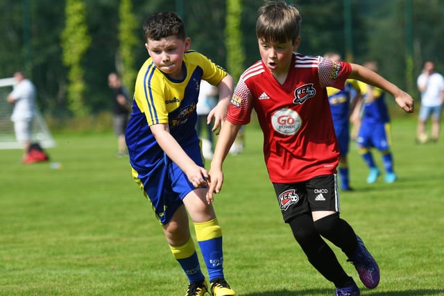 Maiden City Colts under-9's player Conor McDermott holds off Eglinton Eagles Colts defender Noah Coyle. Picture by Keith Moore