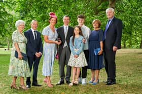 Ray Hutchinson, Managing Director of Gilbert-Ash receives an OBE at Bucking hame Palace London. He is pictured with his family. Photo credit: Simon Jacobs