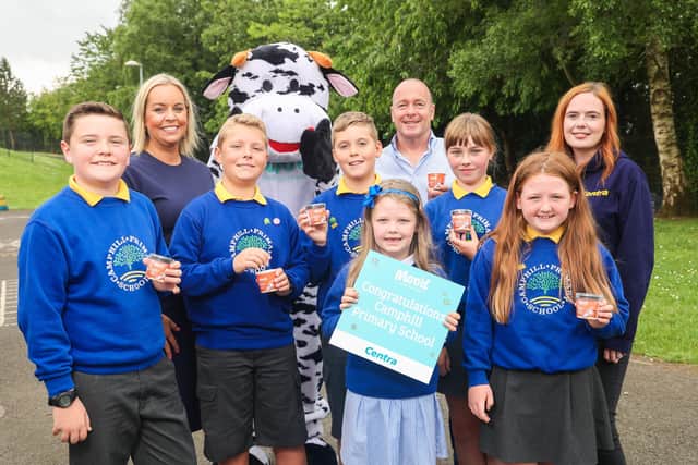 Pupils from Camphill Primary School, from left, Harvey McCullough (aged 11), Adam McMaster (aged 11), Ben McMaster (aged 11), Ruby Corry (aged 10), Olivia David (aged 7) and Ellie Eagleson (aged 9) enjoy their Moo’d ice cream end of term treat. They are joined by school principal Karen McMaster, the Moo’d cow, Peter McCool owner of Centra Ballymena and Claire Rea from Centra.