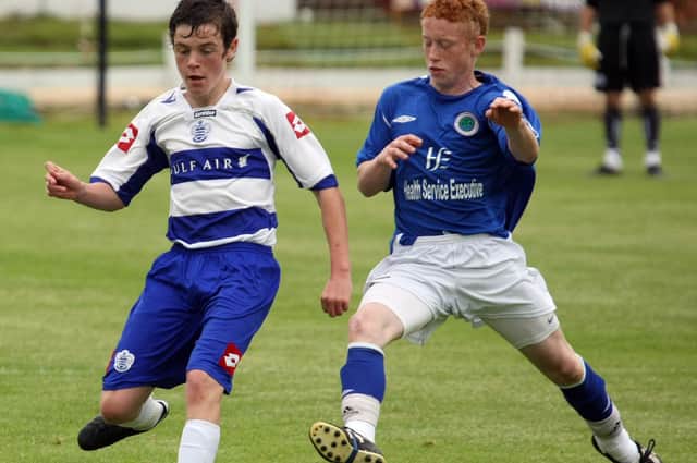 Ryan O'Reilly (NECSL) and Shane McGinty (QPR) in action during the U16 Cup Final, at the Foyle Cup 2010.  2407GM16