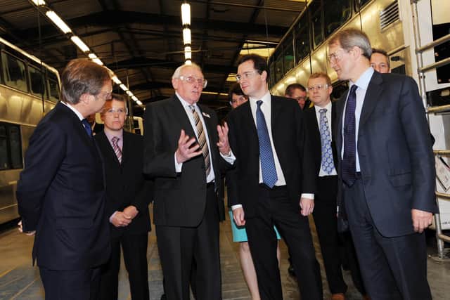 Pictured at Wrightbus in 2011 are the Chancellor of the Exchequer George Osborne, MP with Group Director Dr William Wright, CBE; Secretary of State, Rt Hon Owen Paterson MP and Minister of State Rt Hon Hugo Swire MP. Picture: Pacemaker