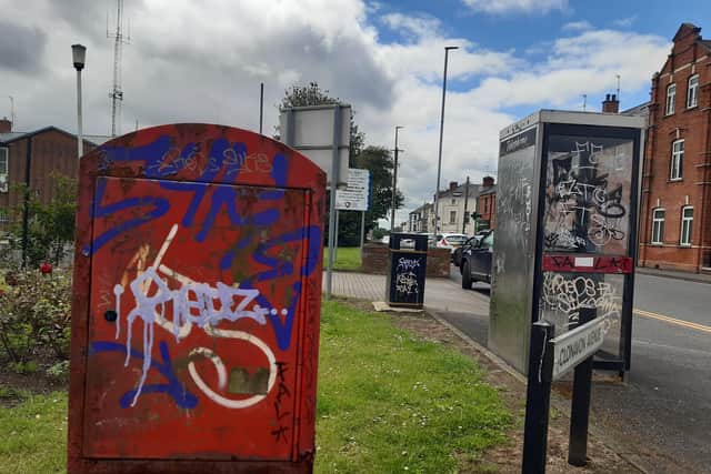 Telephone kiosks as well as litter bins and other service points are covered in graffiti outside the former Cascades Leisure Centre in Portadown, Co Armagh.