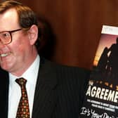 David Trimble pictured with his copy of the Agreement at a press conference in the Europa Hotel in Belfast in 1998. Picture: Pacemaker