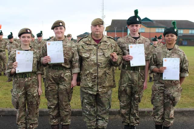 (L-R) Cadet Lance Corporals Sarah Kirk & Alyssa Woods, D Company Commander David Doak, Ballymena Detachment Cadets Jamie Tuff & Angelica De Guzman proudly receiving their John Muir Environmental Award after completing litter-picking projects in the local Ballymena area.