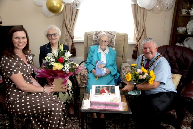 Emma Cairns from Limavady pictured with her sister Margaret Kearney, the Mayor of Causeway Coast and Glens Borough Council, Councillor Ivor Wallace, and the Deputy Lieutenant of County Londonderry, Leona Kane during her recent 100th birthday celebrations