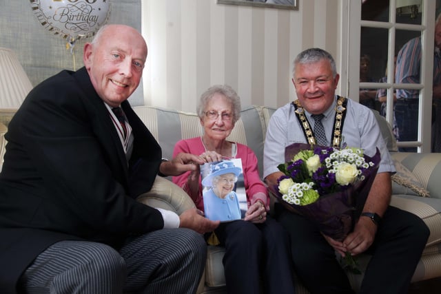 Jean Jackson who celebrated her 100th birthday recently pictured with Peter Sheridan, Deputy Lieutenant of County Londonderry, and the Mayor of Causeway Coast and Glens Borough Council Councillor Ivor Wallace