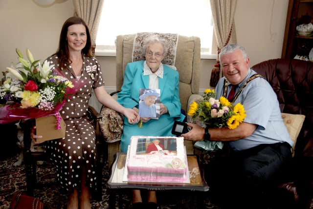 The Mayor of Causeway Coast and Glens Borough Council, Councillor Ivor Wallace and the Deputy Lieutenant of County Londonderry, Leona Kane pictured with Emma Cairns who is celebrating her 100th birthday