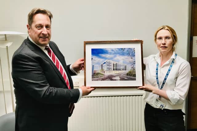 Chairman, Jonathan Patton being presented his painting by Respiratory Consultant Physician, Dr Jennifer Elder