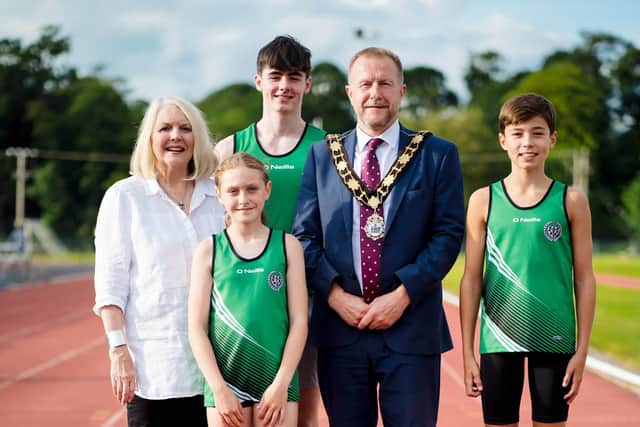 The Kyle legacy lives on at the Northern Ireland Centenary Stadium, pictured at the plaque unveiling in honour of Sean and Maeve Kyle are Shauna Kyle, and athletes from Ballymena and Antrim Athletics Club, founded in 1979 by Sean and Maeve Kyle. Adam Courtney (17), Cora O'Hagan (11), Mayor of Antrim and Newtownabbey Stephen Ross and Evan Tosh (12).