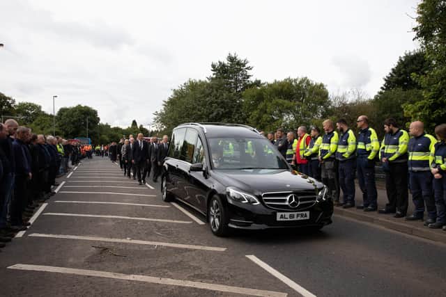 Wrightbus employees form a guard of honour outside the Ballymena factory in tribute to Sir William Wright