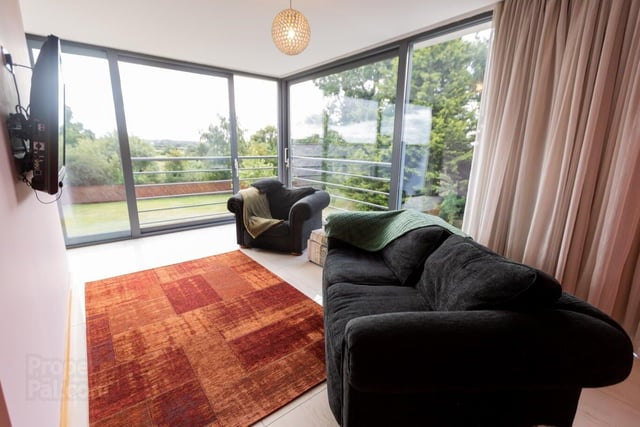 The sitting area of the master suite enjoys stunning views over the rear garden and countryside.