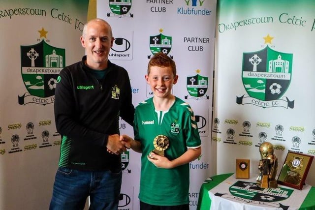 Peter Price presents Daire McKenna with his award for 2011s Supporters' Player of the Season.