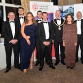Chair of Mid-Ulster Council, Paul McLean, centre, pictured with guests from the main sponsors, Henry Bros, at the Mid-Ulster Business awards in 2021. INMU47-237.
