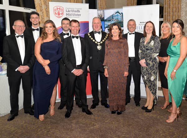 Chair of Mid-Ulster Council, Paul McLean, centre, pictured with guests from the main sponsors, Henry Bros, at the Mid-Ulster Business awards in 2021. INMU47-237.