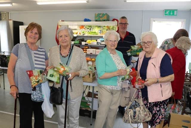 Some of the  Elders availing of the prepack vegetables at Richmount Rural Community Centre's Fruit and Vegetable store at Scotch St near Portadown, Co Armagh. This week the sliced/baton carrots were free. The 20p packs included: cabbage, carrot/broccoli/cauliflower, sliced leeks, soup veg, carrot/turnips, veg stir fry and broccoli/cauliflower.