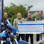 Bob Simpson, Colin Glenn, Paul Mooney, Trevor Campbell, presenting a cheque for £3209 to  John Martin, Portrush and Portstewart RNLI Fundraising Committee