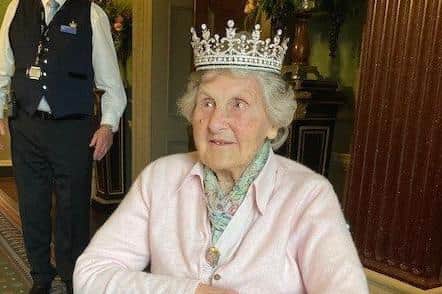 Joan Urquhart had an opportunity to try on one of the Queen’s tiaras.