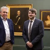 Dr Paul Mullan, Director, Northern Ireland at The National Lottery Heritage Fund  and Councillor Aaron McIntyre, Leisure & Community Development Chairman preview the three Rawdon family portraits on display in the council's Irish Linen Centre & Lisburn Museum