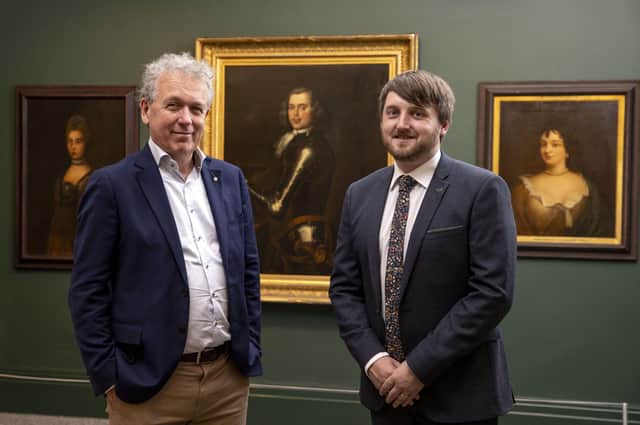 Dr Paul Mullan, Director, Northern Ireland at The National Lottery Heritage Fund  and Councillor Aaron McIntyre, Leisure & Community Development Chairman preview the three Rawdon family portraits on display in the council's Irish Linen Centre & Lisburn Museum