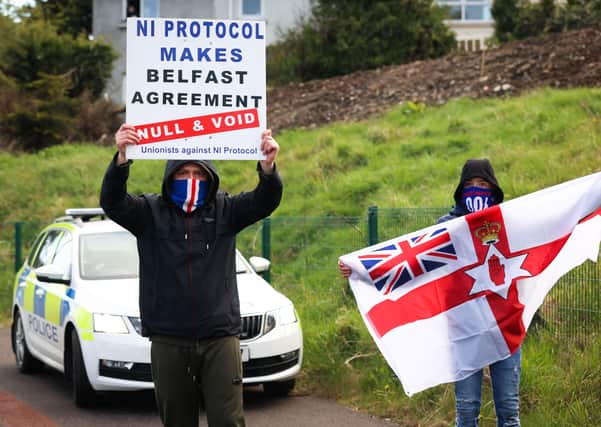 Press Eye - Belfast - Northern Ireland - 6th April 2021

Loyalists take part in a protest at the Antiville roundabout in Larne County Antrim.

Unionist communities loyal to the UK believe the Brexit sea border threatens Northern Irelandâ€TMs constitutional position within the union.

Border Control Posts (BCPs) were built at Larne harbour, and two other facilities in Northern Ireland, as a consequence of Brexit.

Photo by Kelvin Boyes / Press Eye.